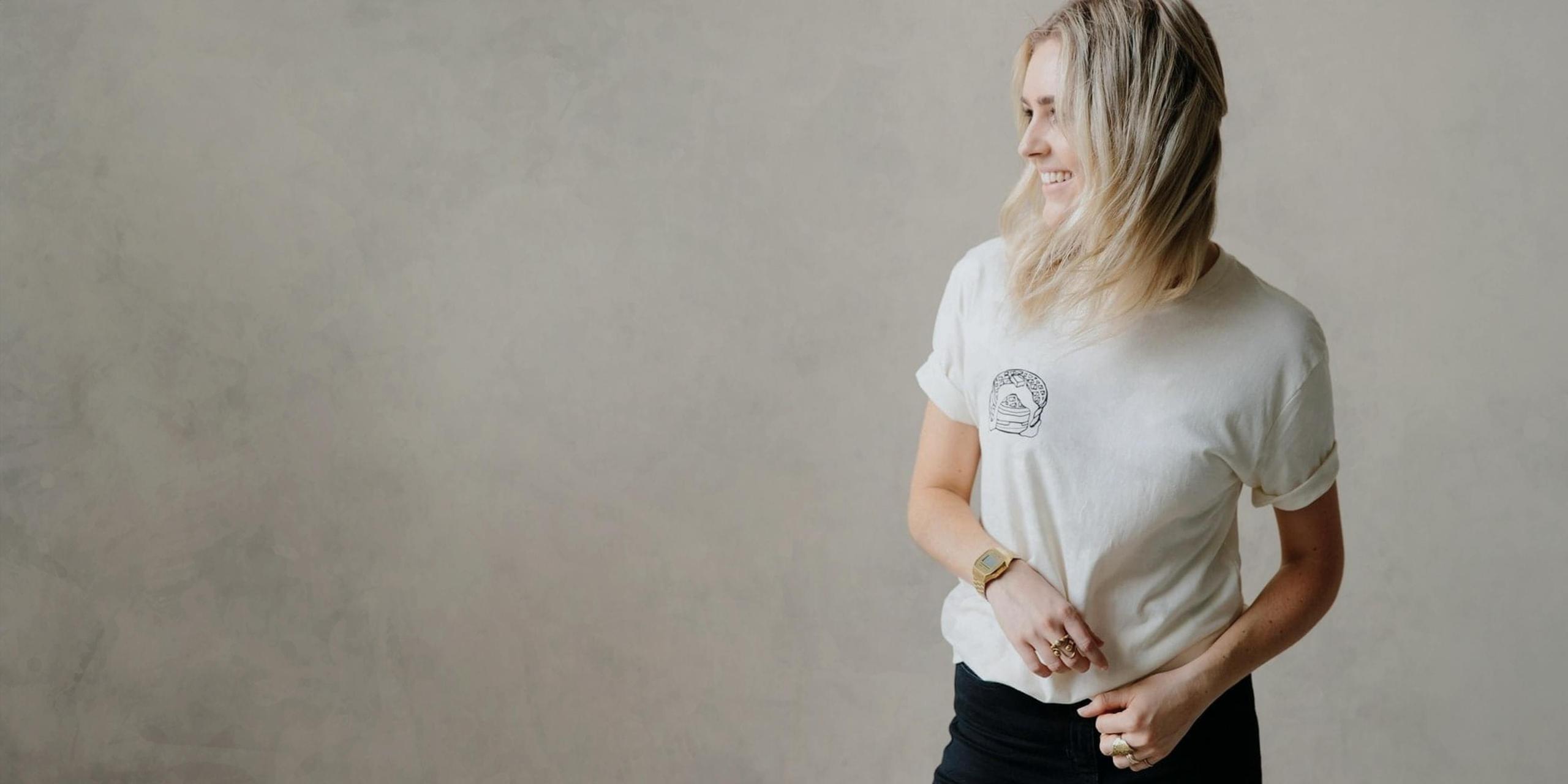 women wearing a tan shirt with pancakes printed on the left side